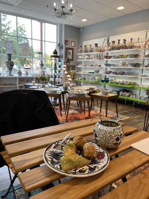 Four types of baklava and a room full of loverly pottery.