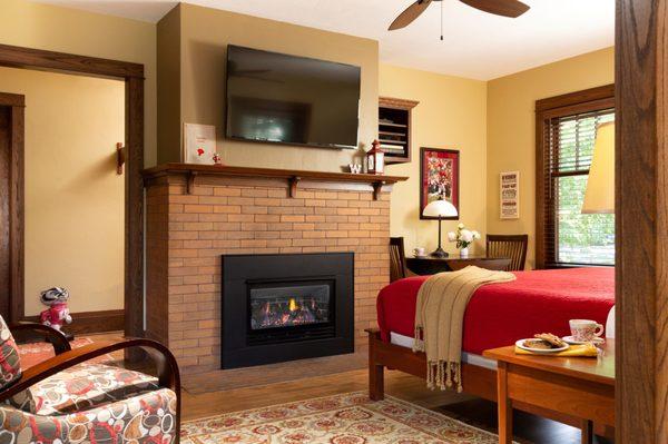 Varsity Suite bedroom features a gas fireplace