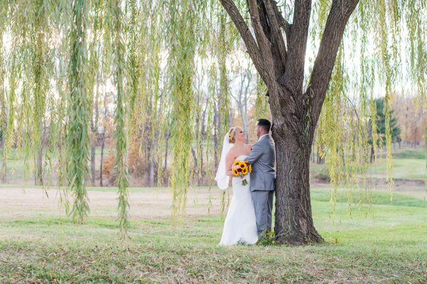 Couple out back by the weeping willow