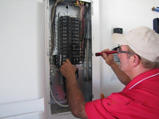 The main breaker panel being checked.