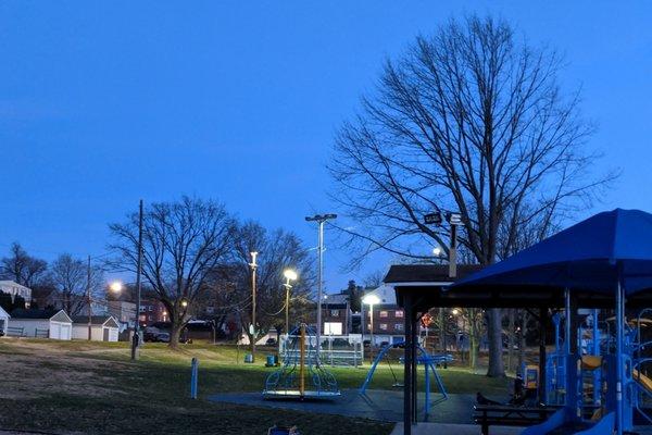 Sutcliffe Park -- Basketball courts lit at night