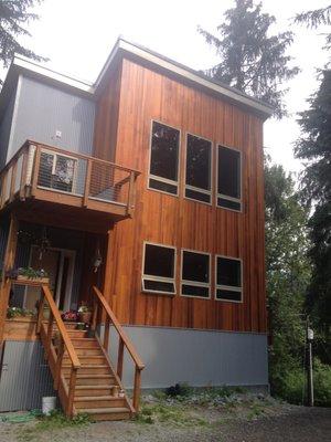 Corrugated steel and cedar siding