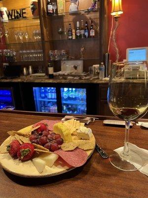 Nice charcuterie plate with Wisconsin cheeses and a smooth glass of wine. New wine and cheese bar, they also have beers and seltzer's.