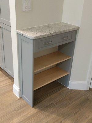 Shoe storage to match existing cabinetry.