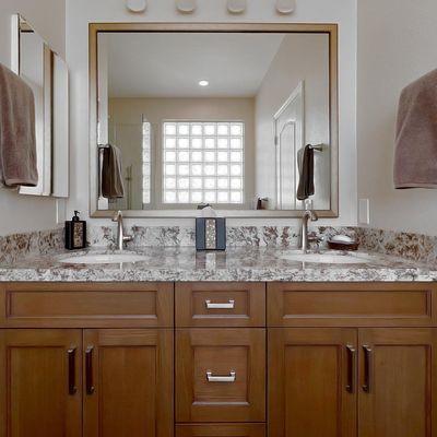 Sleek new cabinets and fixtures give this bathroom a modern and fresh look.