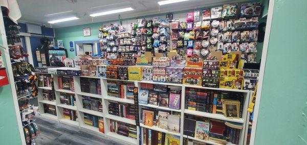 The pegboard and center isle have something for everyone of all ages. While the shelves are holding Childrens, Young Adult, Religion and Pre