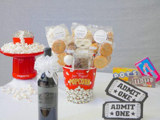 Movie Package - 2 movie tickets, popcorn 2 Salty Carmel, 2 Almond, 2 DK, 4 cookie pies, 2 lg brownie, half dz cake pops, 8 choc pretzels