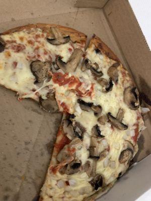 Cauliflower pizza crust with mushrooms and onions