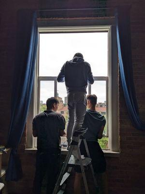 Quality Windows Repair team adjusting window