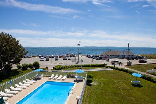 Outdoor pool and front lawn with Bocce ball court, horseshoe pit and fire feature