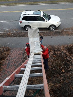 Our mighty movers hoisting an oversized hutch through a window..at no extra charge !