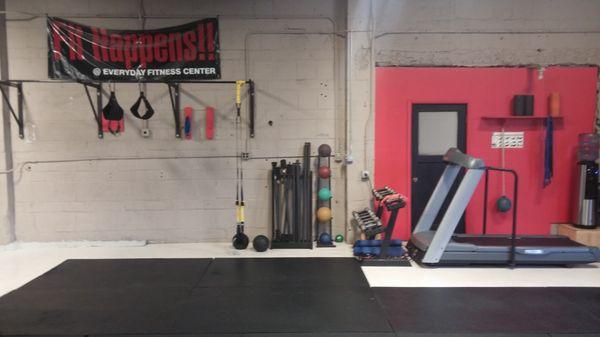 Pull up bars with some accessories, general workout area. Classes also held here.