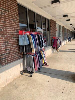 Racks of clothing outside!