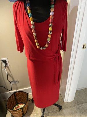 A simple red dress with lovely beaded necklace made from recycled silk sari from India!