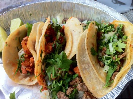 Spicy pork and steak tacos with extra cilantro.