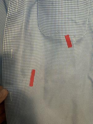 A shirt that was supposed to have been cleaned, but left with stains