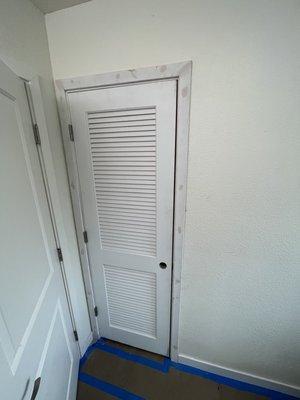 Louvered door for a water heater