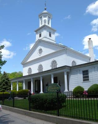 front of the church on a sunny spring day