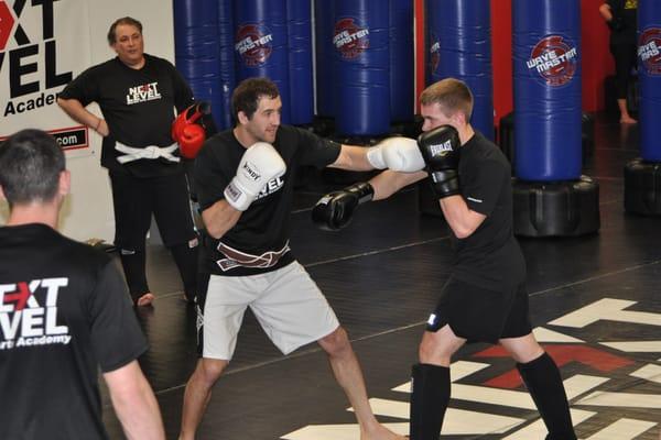 Coach James Terlecki giving instruction during the kickboxing class