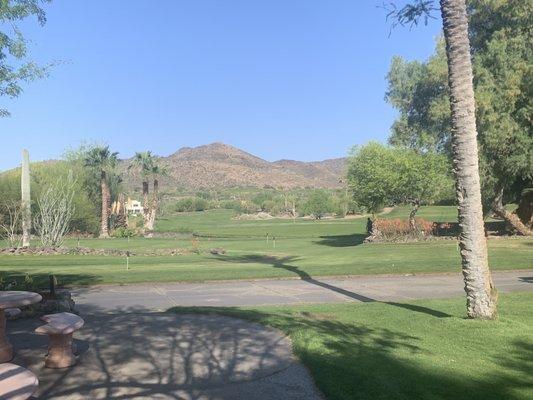 View of the practice green and 18th green.