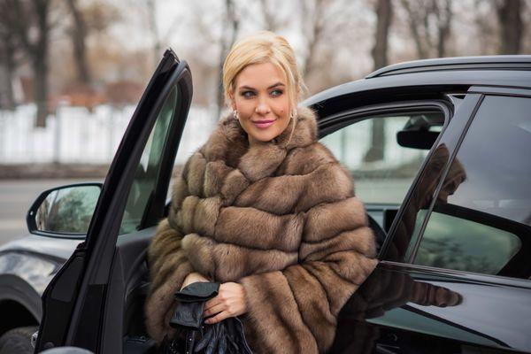 Highmark Valet - Woman in fur coat arriving in luxury car