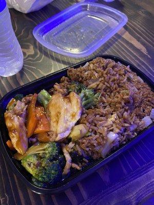 Chicken and broccoli with fried rice.