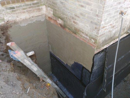 Three-phase, commercial grade exterior basement waterproofing backed by lifetime, transferrable warranty by Sitework Developing Inc.