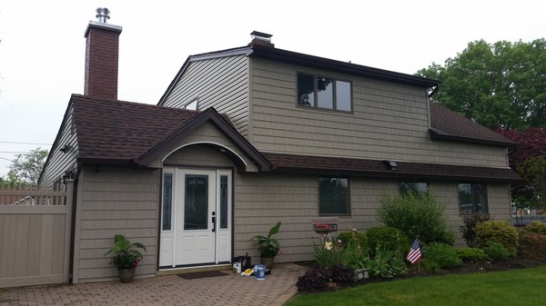 Front door relocated, new siding, new kitchen window, radiant floor heating, porcelain plank tiles through out, kitchen gut and remodel.