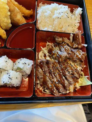 Beef Teriyaki Bento - Beef, house teriyaki sauce, shrimp & veggie tempura, ginger salad, miso soup, steamed rice, California roll.