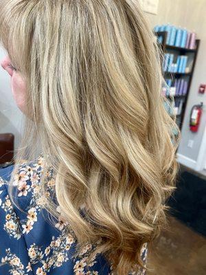 A root touch-up in reverse balayage involves a creative and unique approach to refreshing hair color. In traditional balayage, lighter tones