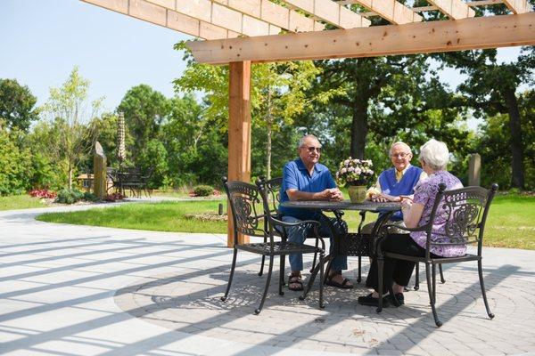 Drinks with friends enjoying the sunshine in the Memorial Garden