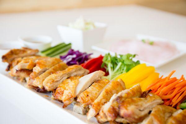 SSAM Chicken: Oven Roasted Chicken w/ assorted vegetables to wrap 
in thinly sliced radish served w/ 2 dipping Sauces