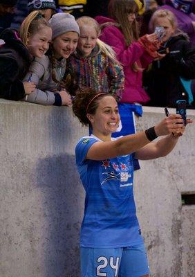 Post game photos and autographs are a regular occurrence as these fans get a selfie with Red Stars midfielder Danielle Colaprico.