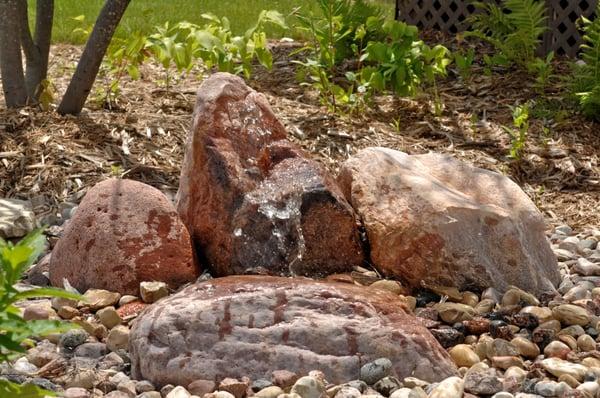 Simple water feature.  The water used is harvested from the roof and recirculated.