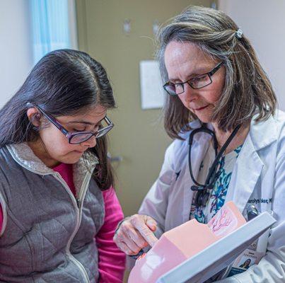 Carolyn Tucker, NP, takes the necessary time with a special needs patient who is interested in learning more.