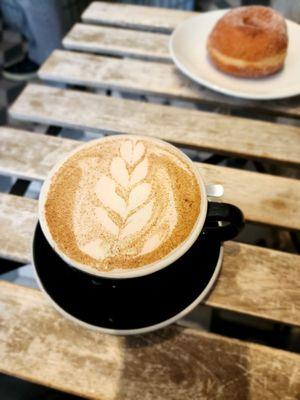 Chai latte, with fresh donut as a bonus in the background!