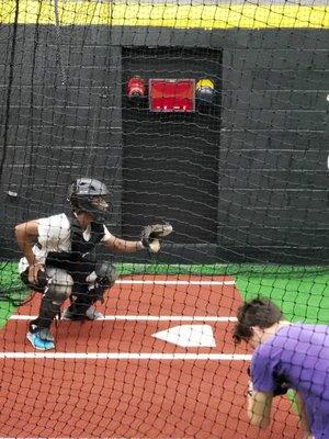 Catching drills at On Deck PG Batting Cages