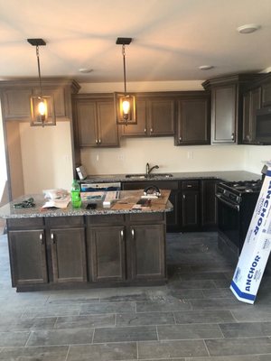 Kitchen granite counter tops and our island and lights we chose