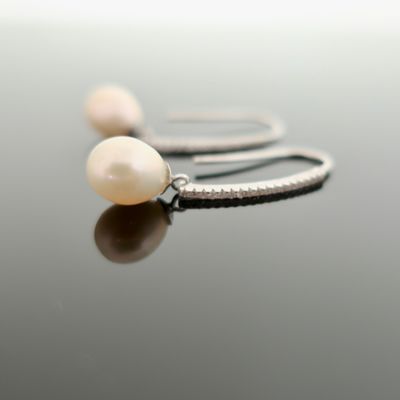 AAA quality white teardrop pearls on sterling CZ ear hooks