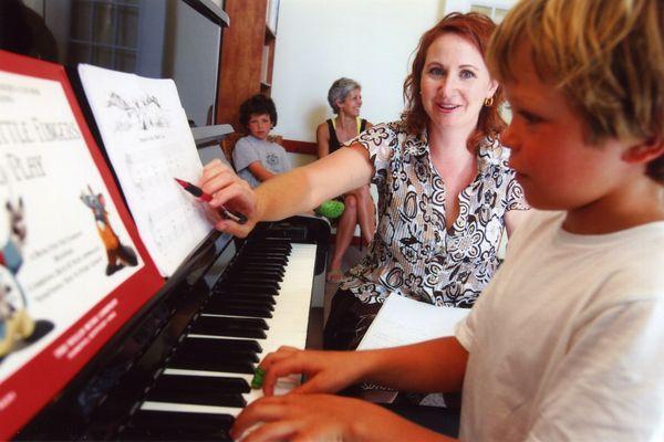 Our piano instructor Laurie during a kid's private piano  lesson  |