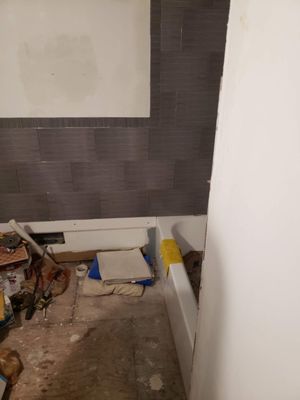 While working on the tiling of the floor and wall