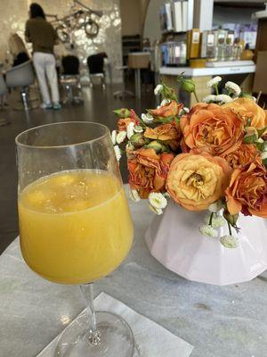 Complimentary mimosa and lovely fresh flowers in the waiting area