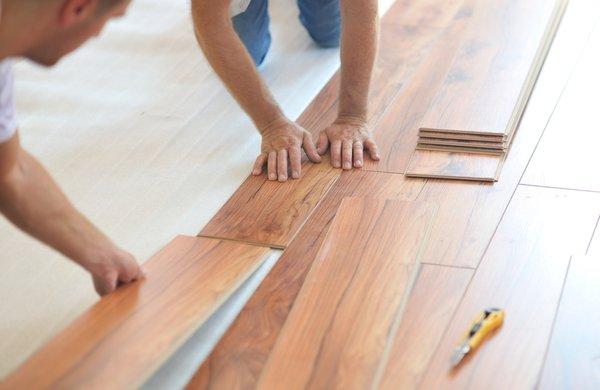 Strongsville Flooring Contractors at work installing laminate parquet