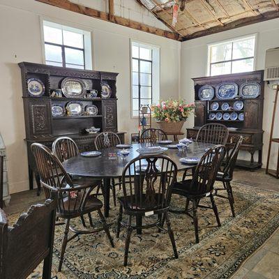 Traditional style dining. Oak oval tapered leg table shown with Windsor splat back chairs. Welsh dressers to showcase your favorite china.