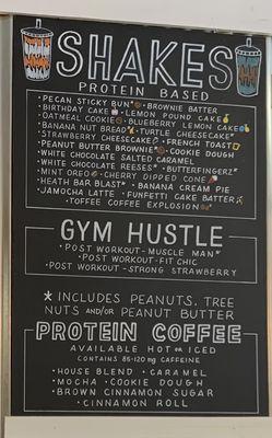 Shakes and Protein Coffee menu on chalkboard in store