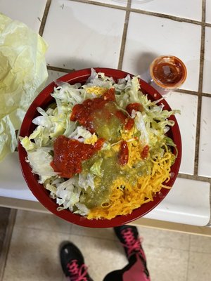 The fantastic chicken burrito bowl with the hot sauce added!