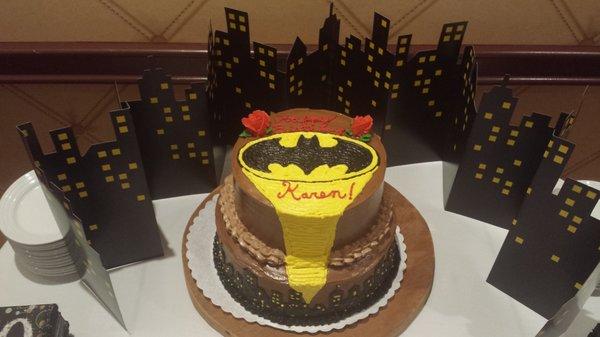 I'M BATMAN!!!  A Two Tier Chocolate frosted, mousse filled Monster.  Cityscape with the Bat Signal to to top of the cake!