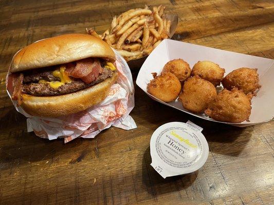 Double cheese burger, fries and hush puppies