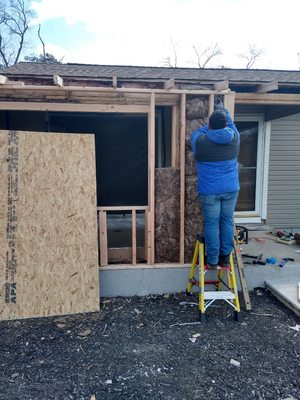 Installing insulation.