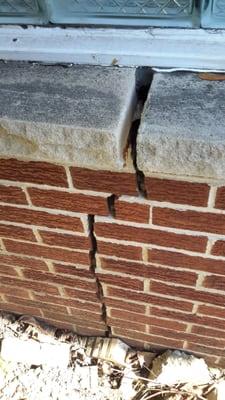 Cracked garage exterior wall.